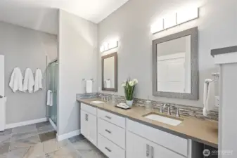 Full bath downstairs with shower, double sinks and bathtub