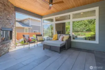 Covered patio with ceiling fan and gas fireplace make this an appealing space for relaxation and entertaining