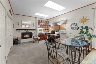 Family room with gas fireplace and 2 skylights
