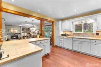 Large island breakfast bar open to dining, family and living room
