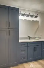 Main bath has lots of storage, including a linen closet