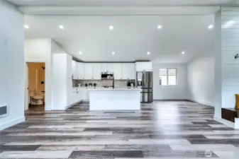 Stunning finishes you're going to love. Bar seating + room for dining table to the right.