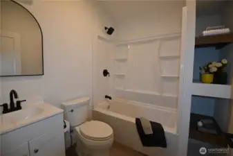 Inviting full bath with stylish fixtures.
