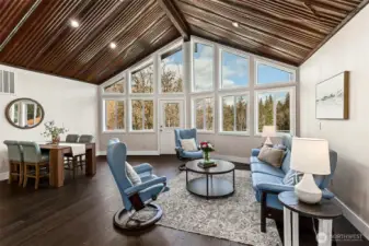 Main House-Living Room with A frame windows overlooking property