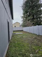 Flat fully fenced backyard
