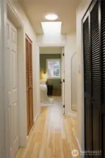 Hallway to the bedroom with a skylight.