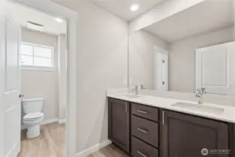 Main bath features double sinks and door to separte. Photo's are for representational purposes only. Colors and finishes may differ.