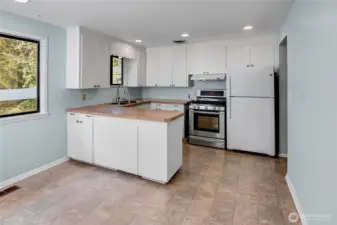 Kitchen with dining space is very functional as is, or easy to remodel to your hearts desire.