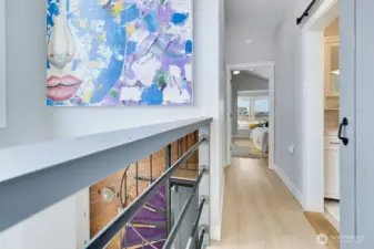 Upstairs to primary bedroom, 3/4 bath & open loft w/ views