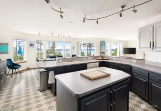 Stay engaged with those you love as you prepare meals. This kitchen delivers big time with loads of counter space and storage. Not to mention those views!