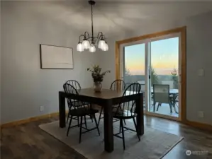 dining area with slider to the rear patio