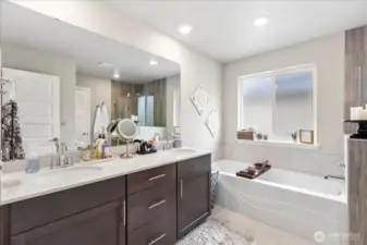 Double vanities and deep soaking tub are much appreciated features of the luxe bath.