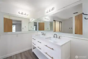 Ensuite full bath with blending eras of style.