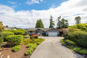 A gardener's dream front yard with robust foliage.