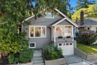 This adorable craftsman bungalow sits up from the street and is full of charm!