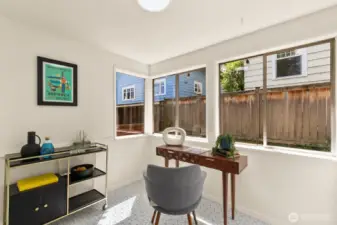 Sunroom/Office nook off of the kitchen. This could make for the perfect future mudroom/laundry room!! The door to the backyard and basement access is to the right in this photo.