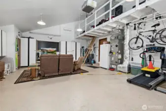 2 car garage has terrific built in storage, mini split for heat & cool & loft space access for more storage