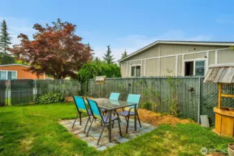 Side yard in the fenced backyard