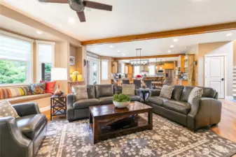 Great room concept with spacious living. Custom window seat to left of frame.