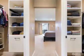 His/Her's walk-in closets flank the entry to the ensuite.