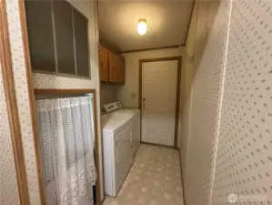 Washer dryer included. door to the back of the home.