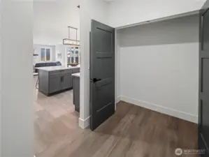 Pantry/Utillity storage room off of kitchen leads to garage.