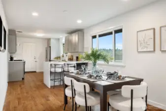 Open layout for the living, dining and kitchen.