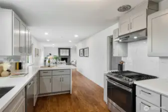 Kitchen has been updated; newer cabinetry, quartz counters, and stainless appliances.