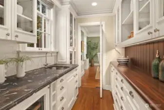 Large butler pantry between kitchen and dining room.