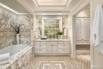 Elegant primary bath with marble details throughout.