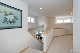 Stairs lead to a large open bonus loft