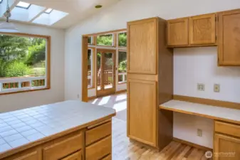 Sunny dining space with built in office nook.
