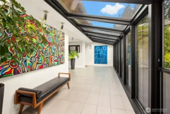 Sunroom with heated tile floors is bathed in morning sun