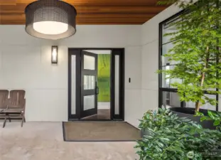 Covered entry with wood ceiling