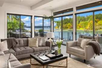 Fabulous indoor/outdoor living...four sliding glass doors lead out to the deck