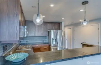 large open concept kitchen with granite countertop