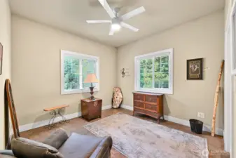 The third bedroom looks out to a natural settting.
