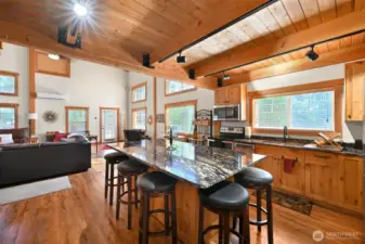 Warm and spacious kitchen area with custom lighting.