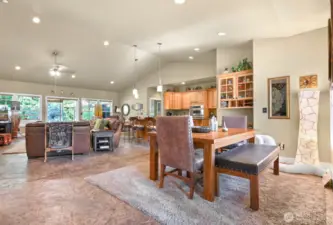 Walk through the front door to find the warm and open Great Room . Notice the custom concrete floors tht flow throughout the house.