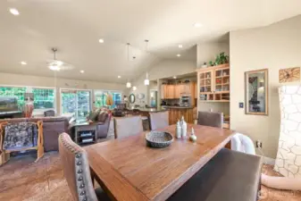 The dining area accommodates a large dining room table and has a built in serving counter and cabinet.