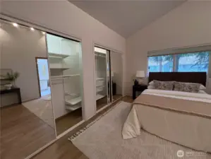 Stay effortlessly organized with a full wall of mirrored closet doors and custom built-in shelving—style and storage all in one.