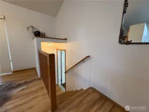 A short flight of stairs leads directly to the attached two-car garage—making comings and goings easy, with convenient access to storage and parking.