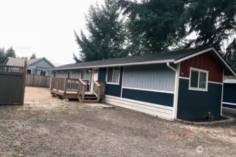 New roof, good size deck, partially fenced yard, parking for 2 cars and more!