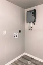 View of the utility area located in the main bathroom.