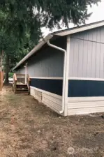 View of the side yard and second entrance.