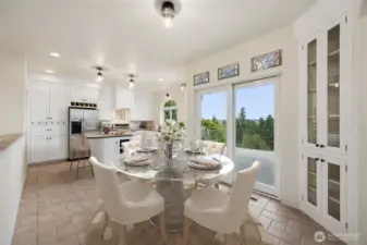 Beautiful stain glass in the Dining area with access to deck. Virtually staged
