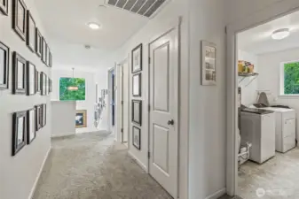 Wide hallways and high ceilings - upper laundry...