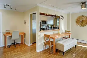 Cozy dinning table, kitchen and office corner.