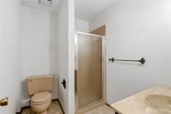 Three quarter bath between the family room and off the garage.