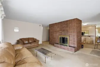 Clean fireplace with screens and glass doors - what's better than a real wood burning fire on cold evenings.